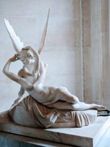 Antonio Canova's marble masterpiece, Psyche Revived by Cupid's Kiss, housed at the Louvre.