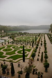 Foggy day at the intricately designed Gardens of Versailles, a UNESCO World Heritage site.